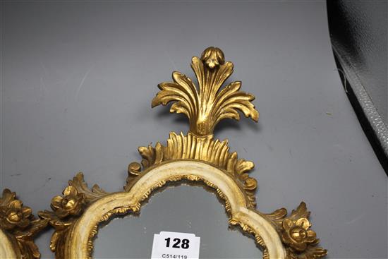 A pair of Italian giltwood cartouche shaped wall mirrors, width 25cm, height 43cm